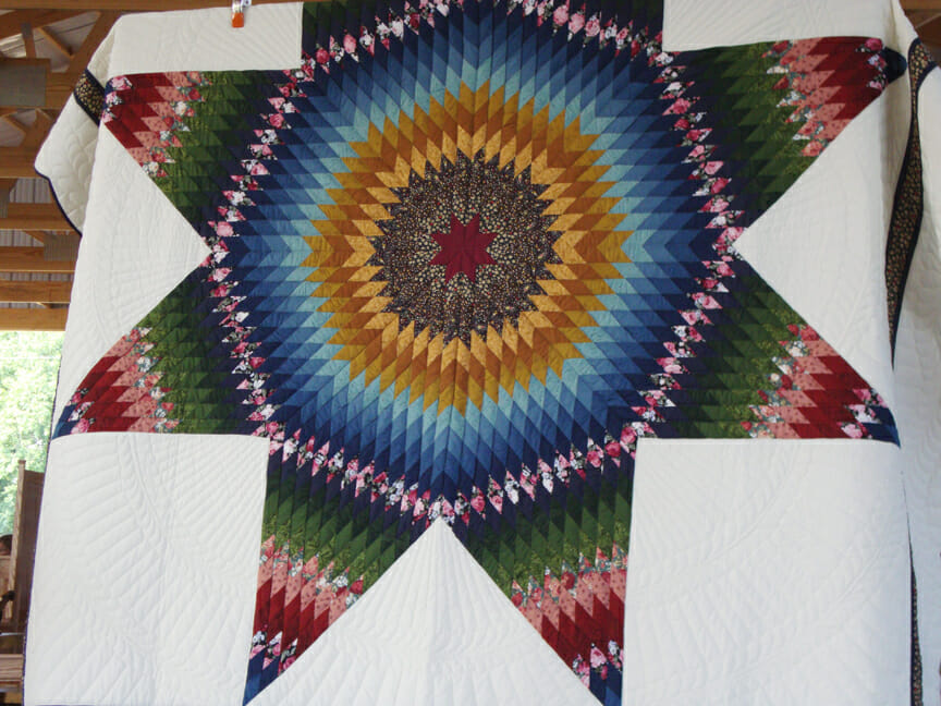 Hand quilted beauties at an Amish Quilt Auction Quilt Addicts Anonymous
