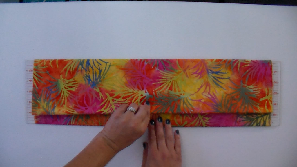 How to fold fabric to fit your storage space Quilt Addicts Anonymous
